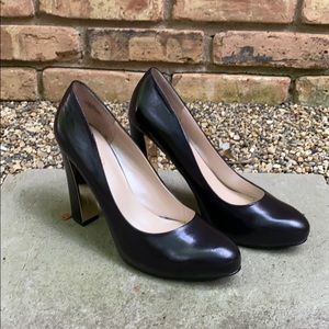 Nine west, size 9, black pumps, gold trimmed heel